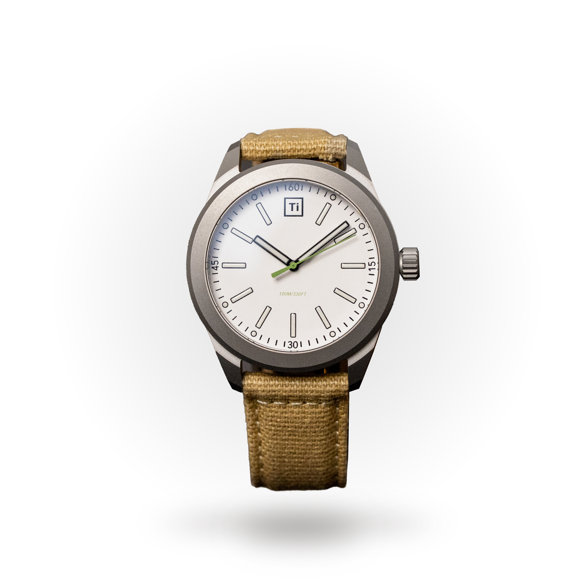 Big Idea Design LLC titanium field watch with white dial green accented hands and tan canvas strap