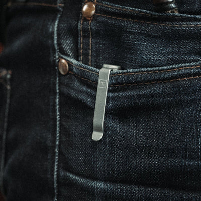 EDC bolt action pen clip attached to dark denim jeans pocket by Big Idea Design LLC