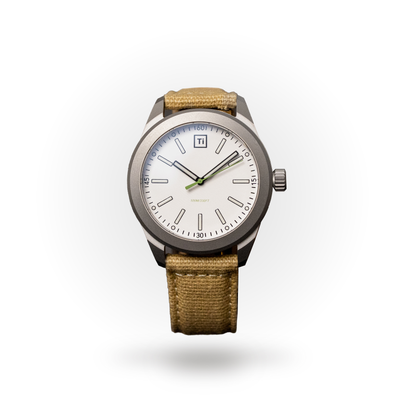 Big Idea Design LLC titanium field watch with white dial green accented hands and tan canvas strap