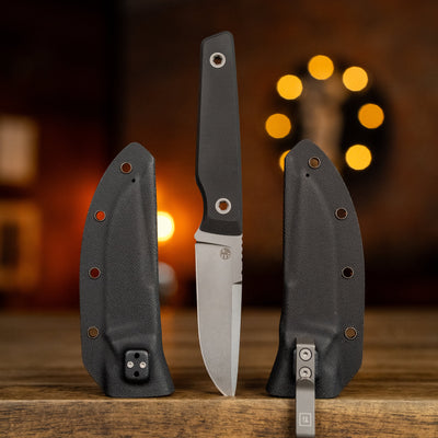 BIGiDESIGN-USA Fixed Blad knife with black handle and protective sheath on wooden surface