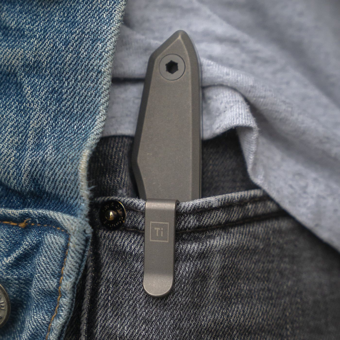 BIG IDEA DESIGN LLC titanium fixed blade knife with titanium clip carried in jeans pocket for everyday carry