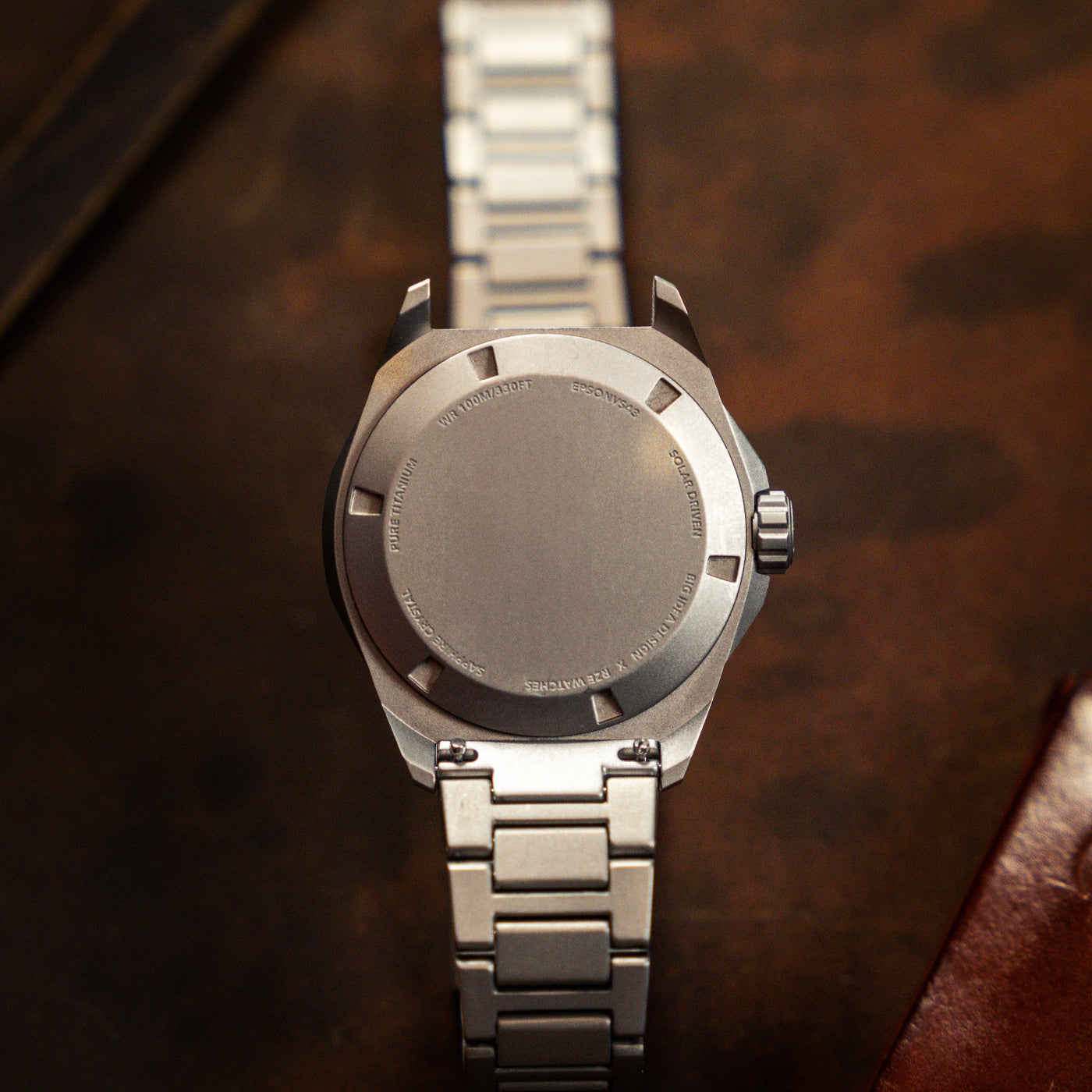 Close-up of a premium titanium bracelet watch band by BIG IDEA DESIGN LLC with a brushed metal finish