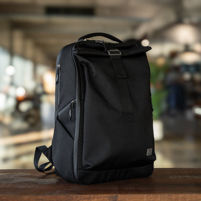 Big Idea Design LLC black everyday carry backpack with roll-top and side zipper pockets