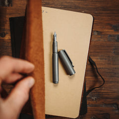 Big Idea Design LLC fountain pen for EDC enthusiasts with matte finish placed on a notebook