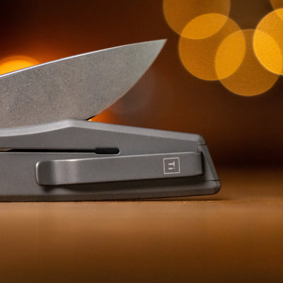 Big Idea Design LLC titanium pocket knife with sleek blade and clip in close-up view