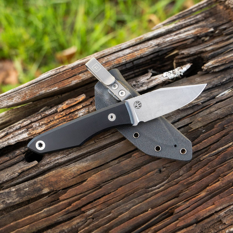 USA lookout fixed blade knife by BIG IDEA DESIGN LLC with black handle and stainless steel blade on wooden surface