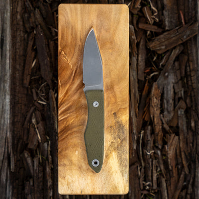 USA Lookout Fixed Blade knife by BIGiDESIGN-USA with green handle on wooden board