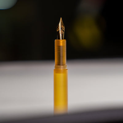 Close-up of a yellow USA made EDC pen with detailed gold nib from BIGiDESIGN-USA