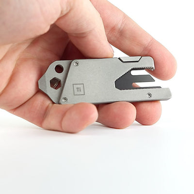 BIG IDEA DESIGN LLC Titanium Pocket Tool EDC held in hand with compact multi-tool features