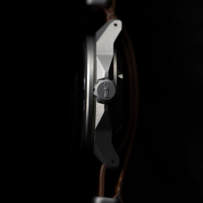 Close-up side view of the solar titanium field watch crown showcasing its durable titanium case