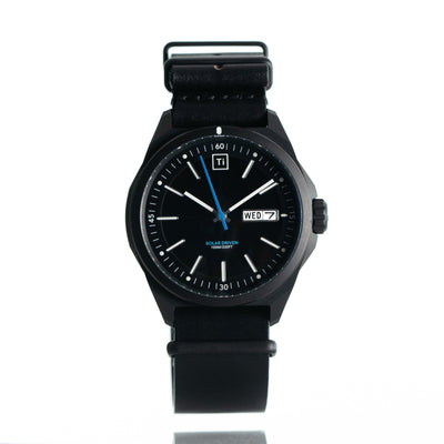 Big Idea Design LLC solar powered titanium watch with black dial and leather strap