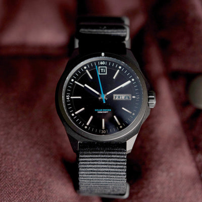 Big Idea Design LLC solar powered titanium watch with black dial and nylon strap