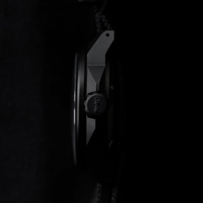 Side profile view of Big Idea Design LLC solar powered titanium watch with matte black finish