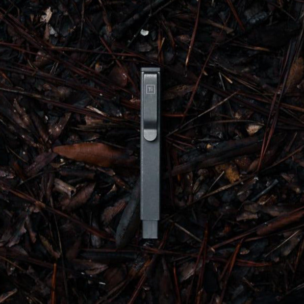 Big Idea Design LLC compact screwdriver set with sleek metal case on dark natural background