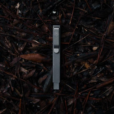Big Idea Design LLC compact screwdriver set with sleek metal case on dark natural background