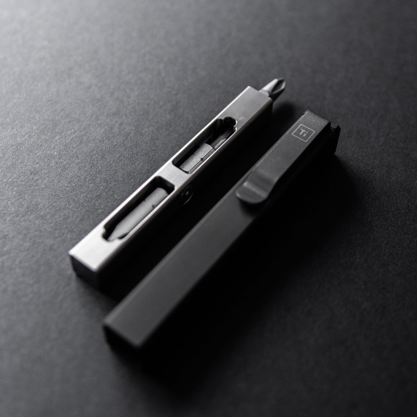 Compact screwdriver set by Big Idea Design LLC with sleek metal and black case on dark surface
