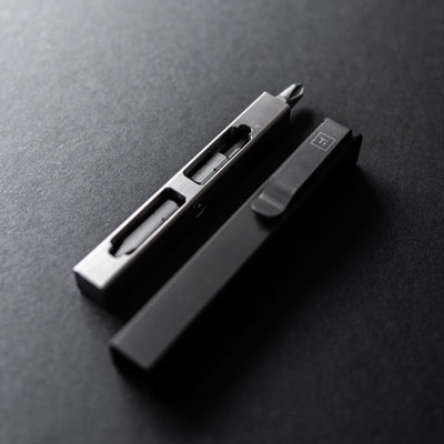 Compact screwdriver set by Big Idea Design LLC with sleek metal and black case on dark surface