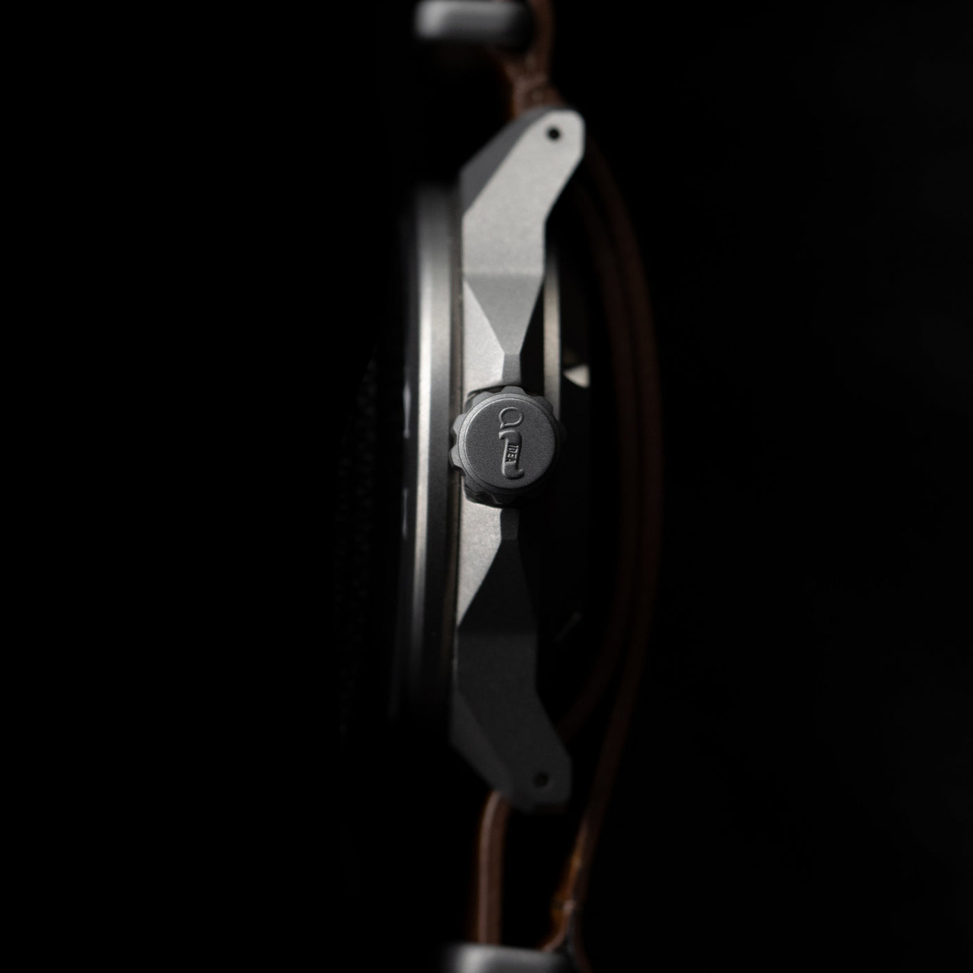 Side view of Big Idea Design LLC titanium automatic field watch showing crown and case details