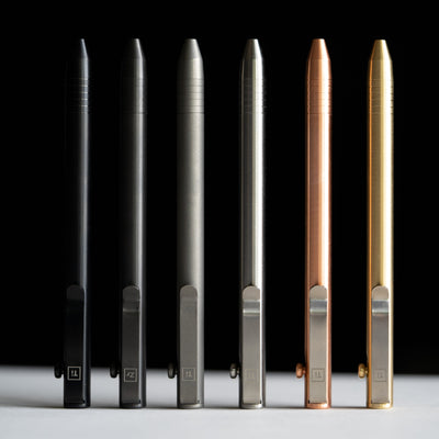 Set of six titanium bolt action pens in black, gray, silver, copper, and gold by Big Idea Design LLC