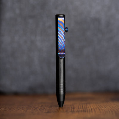 Black pen featuring a colorful Titanium Damascus pen clip with a textured grip from Big Idea Design LLC