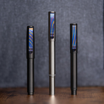 Big Idea Design LLC sleek pens featuring a Titanium Damascus pen clip with colorful pattern accents