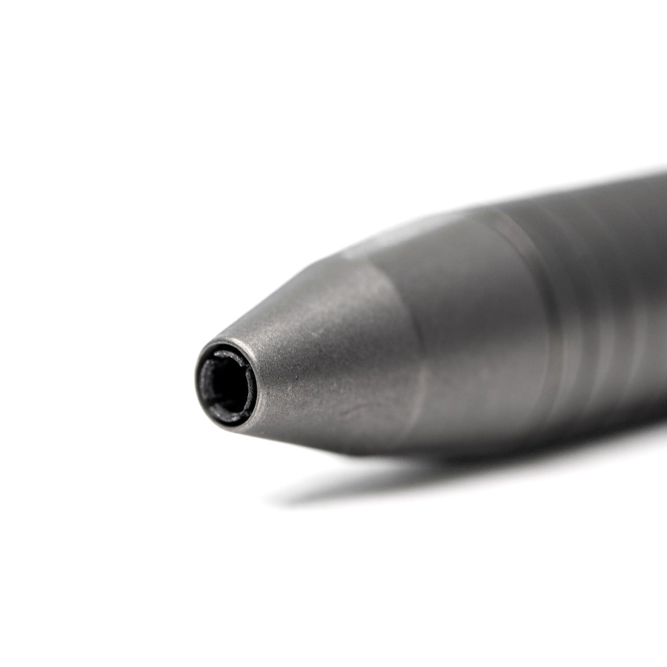 Close-up of Big Idea Design LLC titanium EDC pen tip with sleek metallic finish