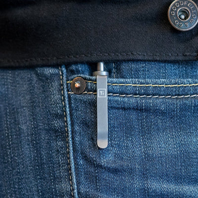 Big Idea Design LLC titanium EDC pen clipped to blue jeans pocket with metal button detail