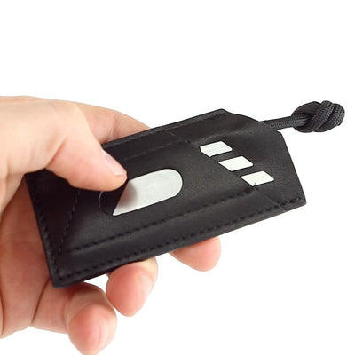 Hand holding black leather pouch carrying Titanium Pocket Tool EDC by BIG IDEA DESIGN LLC