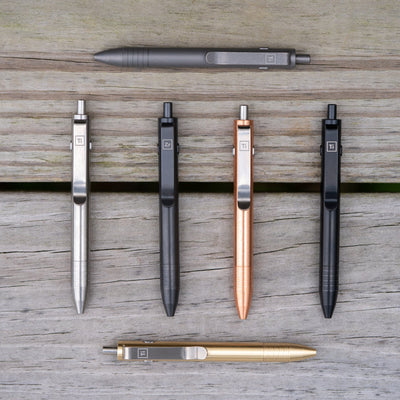 Big Idea Design LLC EDC pen titanium collection in multiple finishes including silver, black, copper, and gold